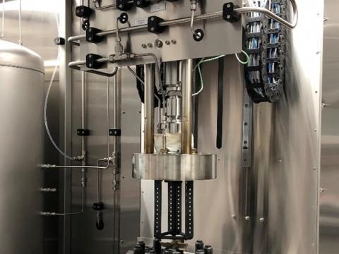 The autoclave with the lid opened before installation of test samples in the sample holder